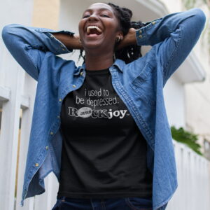 i-used-to-depressed-ROCKjoy-smiling-woman-black-tshirt-walking-street-17317_1500x1500 Woman standing outside smiling with head back wearing a ROCK Fashion brand t-shirt with statement I used to be depressed ROCK joy
