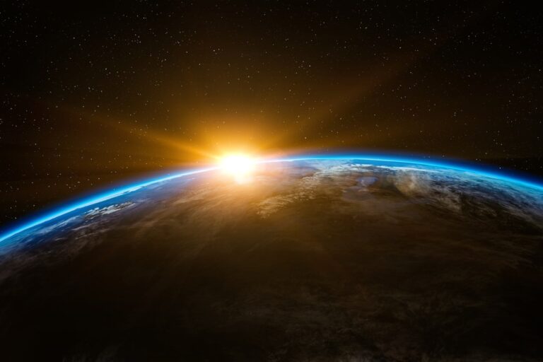 view from space of sun just rising over the earth